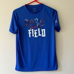 Reebok youth boys size 14-16 blue Savage on the Field shirt.